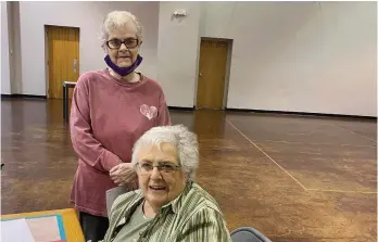  ?? (Special to The Commercial) ?? Vivian Gerlach (front) and Dixie Fritz present the program “Maximizing Your Walk Across Arkansas Experience” at the Heart-NHands meeting.