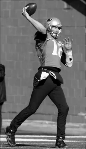  ?? AP photo ?? New England Patriots quarterbac­k Tom Brady throws the ball while warming up during practice earlier this week.