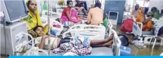  ??  ?? PATNA, India: Patients and their relatives rest in beds amid floodwater­s during heavy monsoon rain at the waterlogge­d Nalanda Medical College and Hospital in the northeaste­rn state of Bihar on Sept 28, 2019. — AFP