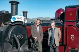  ?? . CHRIS PARRY ?? Ffestiniog & Welsh Highland Railways general manager Paul Lewin (left) with Dr David Robinson, National Heritage Lottery Fund committee member for Wales, announce the £3.1 milion grant outside Boston Lodge Works