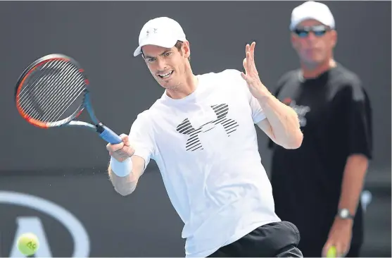  ?? Picture: Getty Images. ?? Andy Murray, closely watched by calm coach Ivan Lendl, during a practise session yesterday.