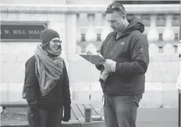  ?? TROY FLEECE ?? Tanya Andrusiecz­ko, left, was collecting signatures for Fight For $15 Saskatchew­an, which was petitionin­g people Friday outside the Cornwall Centre and at the University of Regina for a raise in the minimum wage.