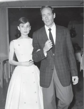  ?? PHOTOS PROVIDED BY PALM SPRINGS HISTORICAL SOCIETY ?? Audrey Hepburn, famously attired by Edith Head, with her husband, Mel Ferrer, at the Racquet Club in Palm Springs c. 1955.