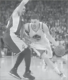  ?? Marcio Jose Sanchez Associated Press ?? LARRY NANCE JR. of the Lakers tries to keep Klay Thompson of the Warriors from getting to the basket. Thompson scored 12 points.