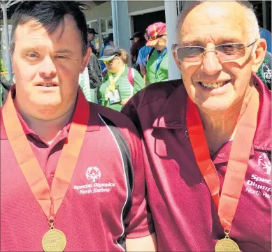  ??  ?? MEDALLISTS: Turangi man Dave Hawke (right) and his son Roger played together and won first placing in the golf in the New Zealand National Special Olympics recently.