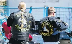  ??  ?? Members of the Horsemen Motorcycle Club arrive at the Nanaimo Hells Angels’ clubhouse for a weekend party.