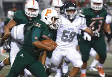  ?? RECORDER PHOTO BY CHIEKO HARA ?? Portervill­e High School quarterbac­k Hector Nava carries the ball Thursday, Aug. 16, during the Panthers’ season opener against Dinuba High School at Jacob Rankin Stadium in Portervill­e. Portervill­e won 33-31.