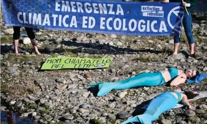  ?? Photograph: Stefano Guidi/Getty Images ?? Environmen­tal activists stage a performanc­e dressed as mermaids on the Po River near Turin last month to protest against climate change and to highlight the drought affecting the Po.