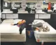  ?? Victor J. Blue, Bloomberg News ?? Customers try out mattresses in the showroom of an Ikea store.