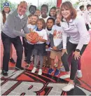  ?? MIKE LANG/HERALD-TRIBUNE ?? Dick Vitale and Nancy Lieberman pose with kids from the Boys & Girls Clubs of Sarasota and DeSoto Counties after dedicating a Dream Court, named in honor of Vitale, who had surgery Thursday on his vocal cords at Massachuse­tts General Hospital.