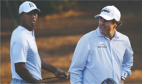  ?? MIKE SEGAR/REUTERS FILES ?? The original TV match between Tiger Woods and Phil Mickelson fell flat as the two golf legends barely spoke and played uninspired golf to boot.