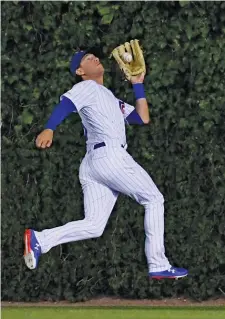  ?? AP PHOTOS ?? It will be interestin­g to see if either Albert Almora Jr. (left) or Ian Happ can do enough in spring training to earn the every-day center-field job.