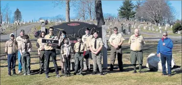  ?? COURTESY OF TROOP 41 ?? Troop 41 is shown with Fitchburg Mayor Stephen DiNatale, far right, with Patrick Edwards holding one of the street signs that was replaced at Fitchburg’s Forest Hill Cemetery as his Eagle Scout project.