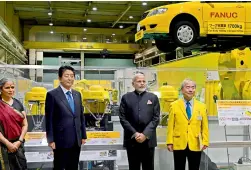  ?? —PTI ?? Prime Minister Narendra Modi and his Japanese counterpar­t Shinzo Abe visit the FANUC Corporatio­n, at Yamanashi, Japan, Sunday.