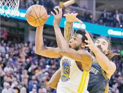  ?? AP PHOTO ?? Golden State Warriors forward Andrew Wiggins (22) and Memphis Grizzlies center Steven Adams, right, battle for a rebound during the second half of Game 4 of an NBA basketball Western Conference playoff semifinal in San Francisco, Monday, May 9, 2022. The Warriors won 101-98.