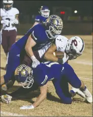  ?? NWA Democrat-Gazette File Photo/BEN GOFF • @NWABENGOFF ?? Booneville’s Cam Brasher (left) and Ian Suttles (on bottom) tackle Prescott’s Keonte Franklin on Dec. 1 during the class 3A state semifinal game at Bearcat Stadium in Booneville.