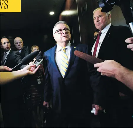  ?? THE CANADIAN PRESS/SEAN KILPATRICK ?? Public Safety Minister Ralph Goodale, left, and Minister of Border Security Bill Blair speak to the media before attending an emergency House of Commons immigratio­n committee meeting to discuss the issue of asylum seekers crossing the Canadian border.