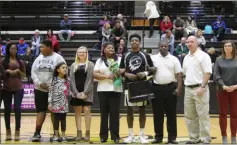  ?? Kevin Myrick / SJ ?? Robert Harris is joined by his family and coach Steve Luke for Senior Night.