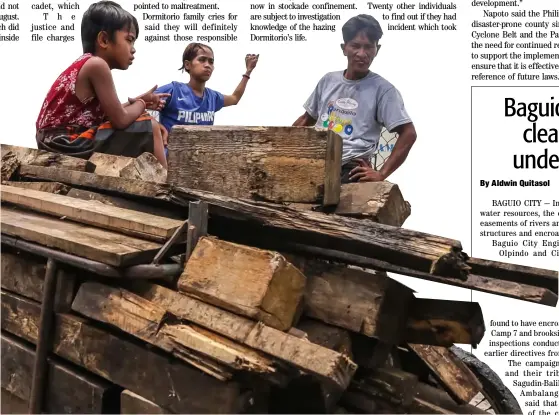  ??  ?? Family business Father and sons gather old wood for livelihood along the streets of Valenzuela.