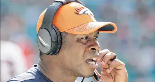  ?? AP PHOTO ?? Denver Broncos head coach Vance Joseph talks on the sidelines during the first half of an NFL game against the Miami Dolphins on Sunday in Miami Gardens, Fla.