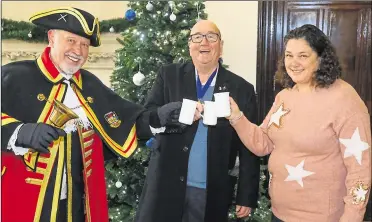  ?? ?? Town crier Brian Sylvester, mayor of Newbury Billy Drummond and Over-80s’ Parcel Fund organiser Jo Fulker
Ref: 48-2421A