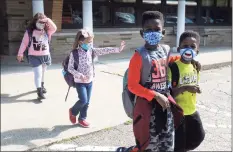  ?? Ned Gerard / Hearst Connecticu­t Media ?? Students leave Sunnyside Elementary School in Shelton at the end of the school day on Wednesday.