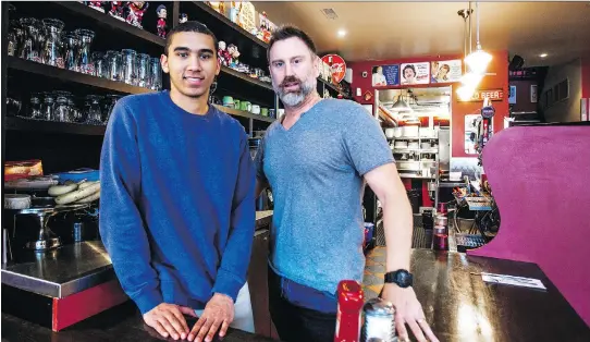  ?? CHRIS DONOVAN ?? Winston Karam, left, and Jeff Frost behind the bar at The Wellington Diner. Karam and his mother successful­ly sued the Ottawa Carleton District School Board in 2016 after Karam was bullied about his race. After hearing his story, Frost, who owns the...