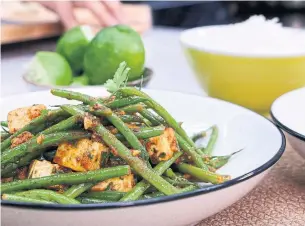  ??  ?? Tofu and Haricots Verts with Chraimeh Sauce is a hearty dish that also happens to be vegan.
