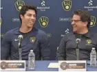  ?? ROY DABNER/FOR THE MILWAUKEE JOURNAL SENTINEL ?? Brewers outfielder Christian Yelich and principal owner Mark Attanasio share a laugh during a news conference Friday announcing Yelich’s new contract.