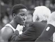  ?? AP/DARRON CUMMINGS ?? San Antonio Spurs head coach Gregg Popovich talks with Indiana Pacers’ Victor Oladipo following Sunday’s game in Indianapol­is. Indiana won 97-94.