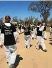  ?? Photo: Contribute­d ?? CROWD GATHERS: Animal activists storm a Millmerran feedlot.