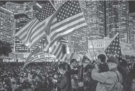  ?? CHRIS MCGRATH/ GETTY IMAGES ?? Pro- democracy protesters hold a Thanksgivi­ng Day rally at Edinburgh Place in Hong Kong.