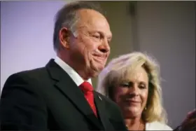  ?? BRYNN ANDERSON — THE ASSOCIATED PRESS ?? In this photo, former Alabama Chief Justice and U.S. Senate candidate Roy Moore speaks at a news conference in Birmingham, Ala., with his wife Kayla Moore, right. A sex scandal has relegated Moore’s hard-line positions on LGBT issues to the background...