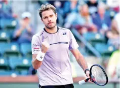  ??  ?? Switzerlan­d's Stan Wawrinka celebrates his Indian Wells Masters firstround victory over Britain's Daniel Evans. - AFP photo