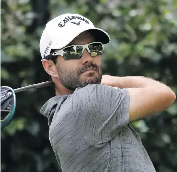  ?? ROB CARR/GETTY IMAGES ?? Adam Hadwin takes a shot during the second round of the Mexico Championsh­ip in Mexico City, Friday, on his way to a 71. The Abbotsford golfer is 10 strokes behind leader Shubhankar Sharma