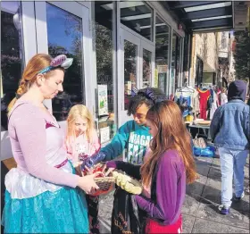  ?? MEDIANEWS GROUP FILE PHOTO ?? Steel River Playhouse participat­es in Pottstown’s downtown life in many ways, such as giving out candy during a recent Haunts on High event in Pottstown.