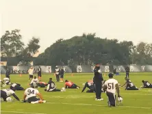  ?? Al Saracevic / The Chronicle ?? The Raiders practice under smoky skies Wednesday. The team cut short its workout Thursday for a second straight day.