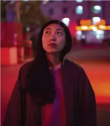  ??  ?? HOMECOMING: Awkwafina plays an aspiring artist who journeys back to the country and family she last saw as a young child.