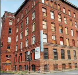  ?? LAUREN HALLIGAN — LHALLIGAN@ TROYRECORD. COM ?? A large former factory at 701River St. in Troy is slated to become a 90- unit apartment building.