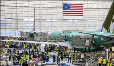  ?? (AP/Boeing) ?? Boeing employees listen last month to Stan Deal, Boeing Commercial Airplanes President and CEO, and other employees in Renton, Wash.