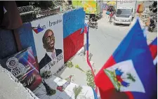  ?? ODELYN JOSEPH THE ASSOCIATED PRESS ?? A mural depicting late president Jovenel Moïse adorns a wall in Port-au-Prince, Haiti in July 2021. A U.S. financier living in Florida was arrested Tuesday in the slaying of Moise.