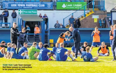  ??  ?? TEAM TALK: Leek Town manager Neil Baker passes on instructio­ns to his players at half time.