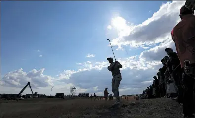  ?? AP/JON SUPER ?? Tiger Woods plays from the rough on the 14th hole at Carnoustie on Wednesday during a practice round of the British Open. Woods said he doesn’t plan to use his driver often because of how far the ball is rolling across tight links grass that looks dead.