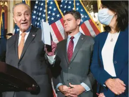  ?? SAUL LOEB/GETTY-AFP ?? Senate Majority Leader Chuck Schumer, D-N.Y., left, speaks Wednesday alongside Sens. Todd Young, R-Ind., and Maria Cantwell, D-Wash., at the U.S. Capitol.