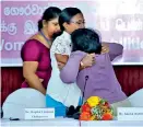  ??  ?? Dr. Shashika Jayalath is supported by her mother to take her seat, while ready to lend a helping hand is Attorney-at-Law Menaka Herath of the HRC