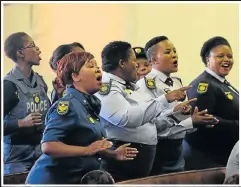  ?? Pictures: WERNER HILLS ?? PAYING TRIBUTE: Mourners at the memorial service for Constable Caroline Mjandana at the Dutch Reformed Church in North End