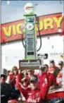  ?? CHARLIE NEIBERGALL — THE ASSOCIATED PRESS ?? Justin Allgaier celebrates with the trophy in Victory Lane after winning a NASCAR Xfinity Series auto race, Sunday at Iowa Speedway in Newton, Iowa.