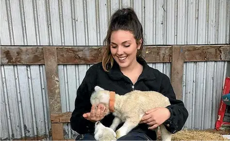 ??  ?? Angelika Loukas loved feeding the lambs at the Whanganui house where she was living.