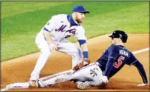  ??  ?? New York Mets third baseman Todd Frazier (left), tags out Atlanta Braves’ Freddie Freeman during the first inning of a baseball game on Sept 18 in
New York. (AP)