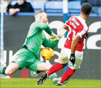  ??  ?? SLOTTED: Nathan Byrne clips home Charlton’s second goal